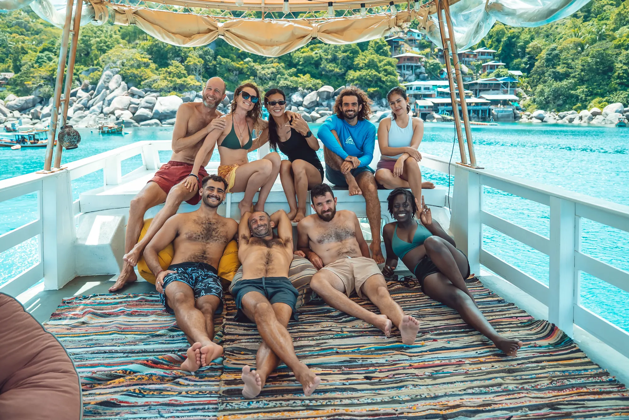A freediving retreat group together on the boat deck
