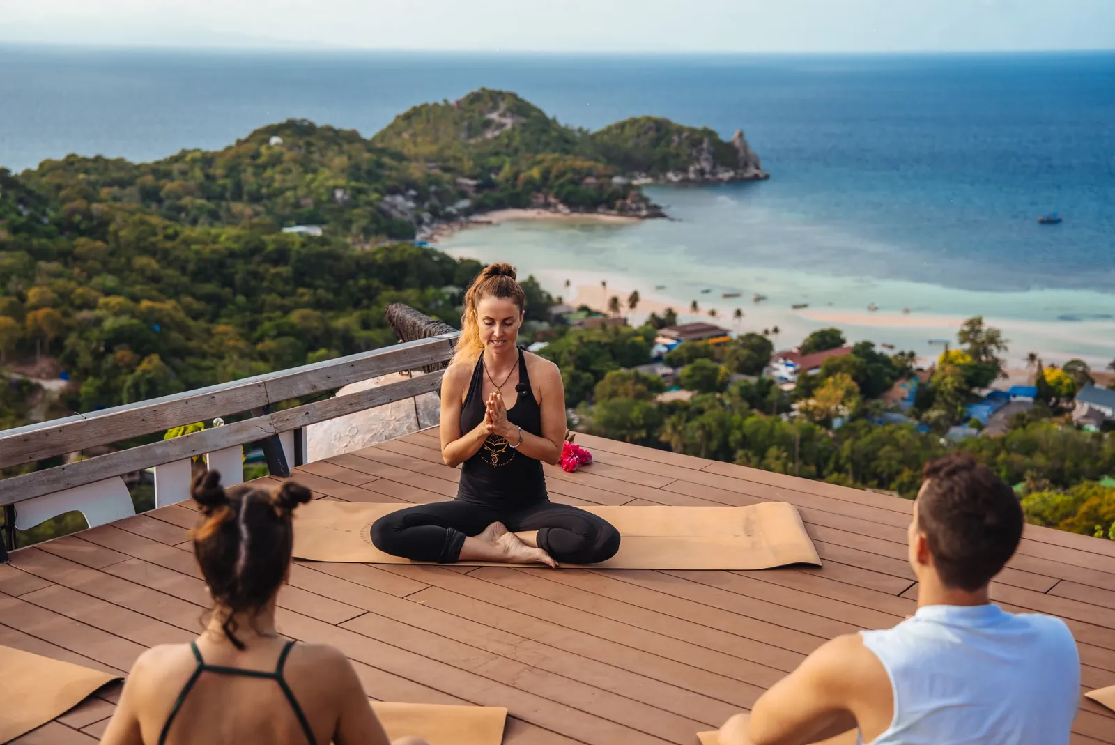 Sunrise yoga class on the High the Moon rooftop deck above Koh Tao