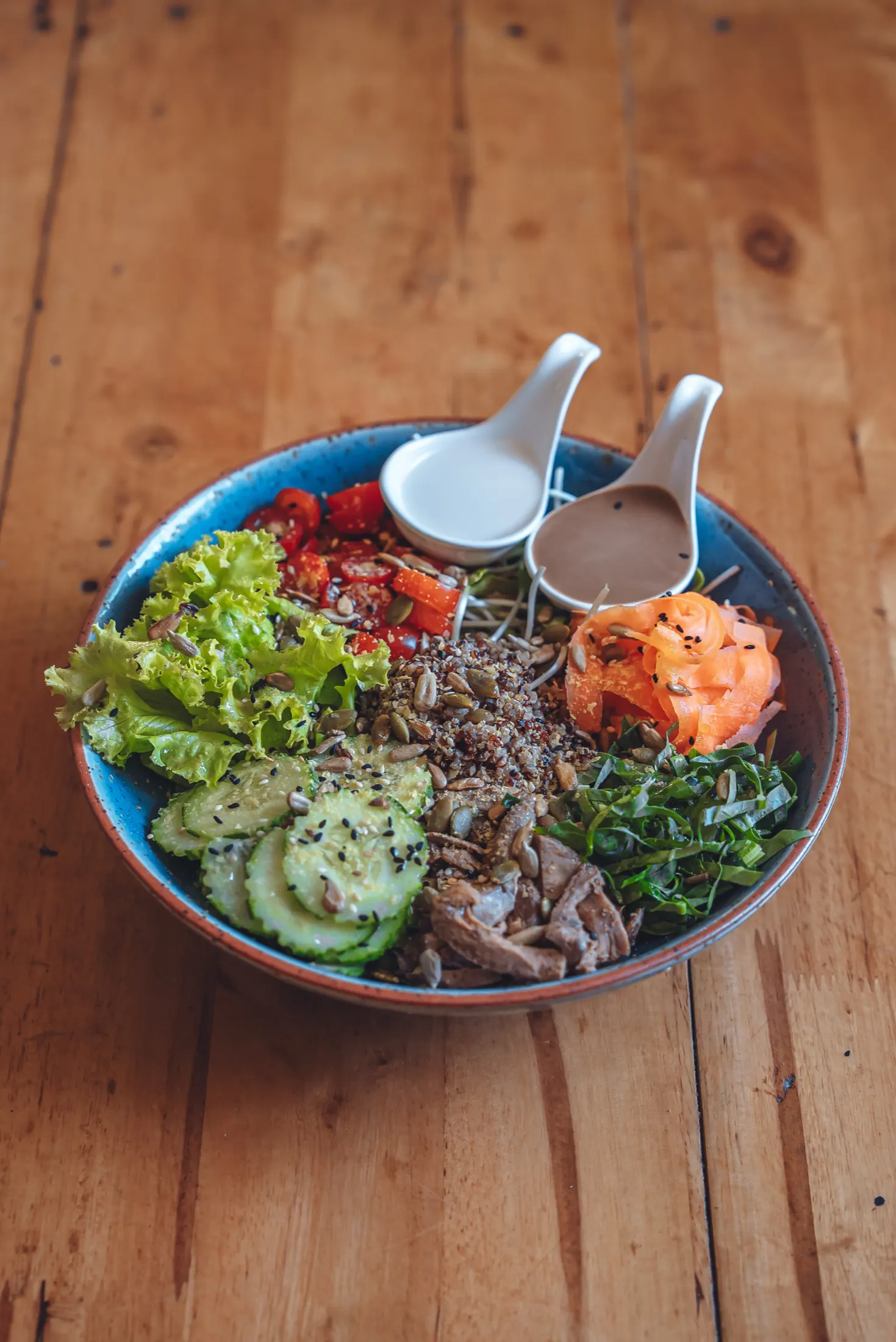 A nourishing salad bowl with homemade dressings