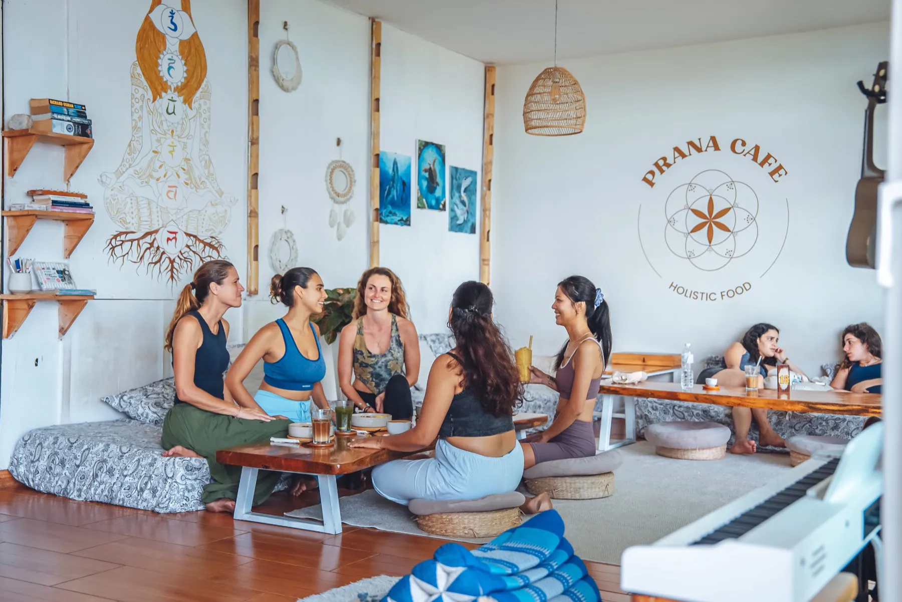 Trainees sharing food and drinks at Prana Café